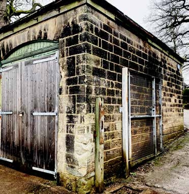 Signs of erosion on the coach house stonework